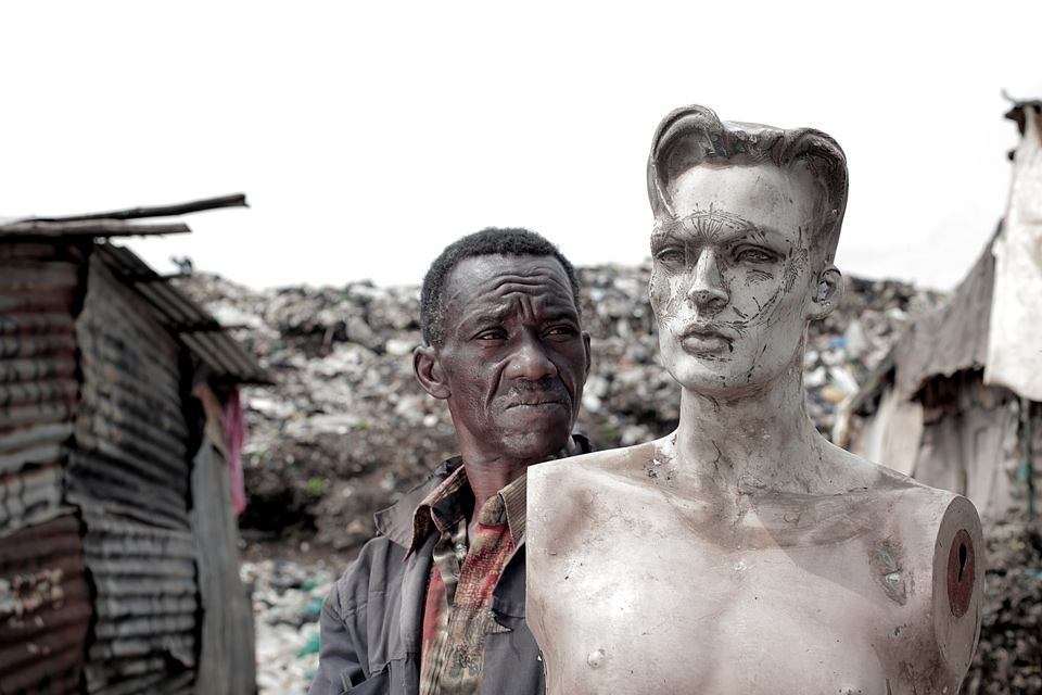 Man-poses-next-to-mannequin-at-Kenya-dumpsite-by-Mario-Macilau