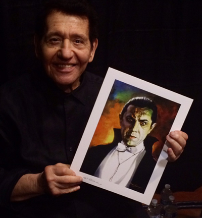 Basil Gogos holds one of his signature portraits at MondoCon